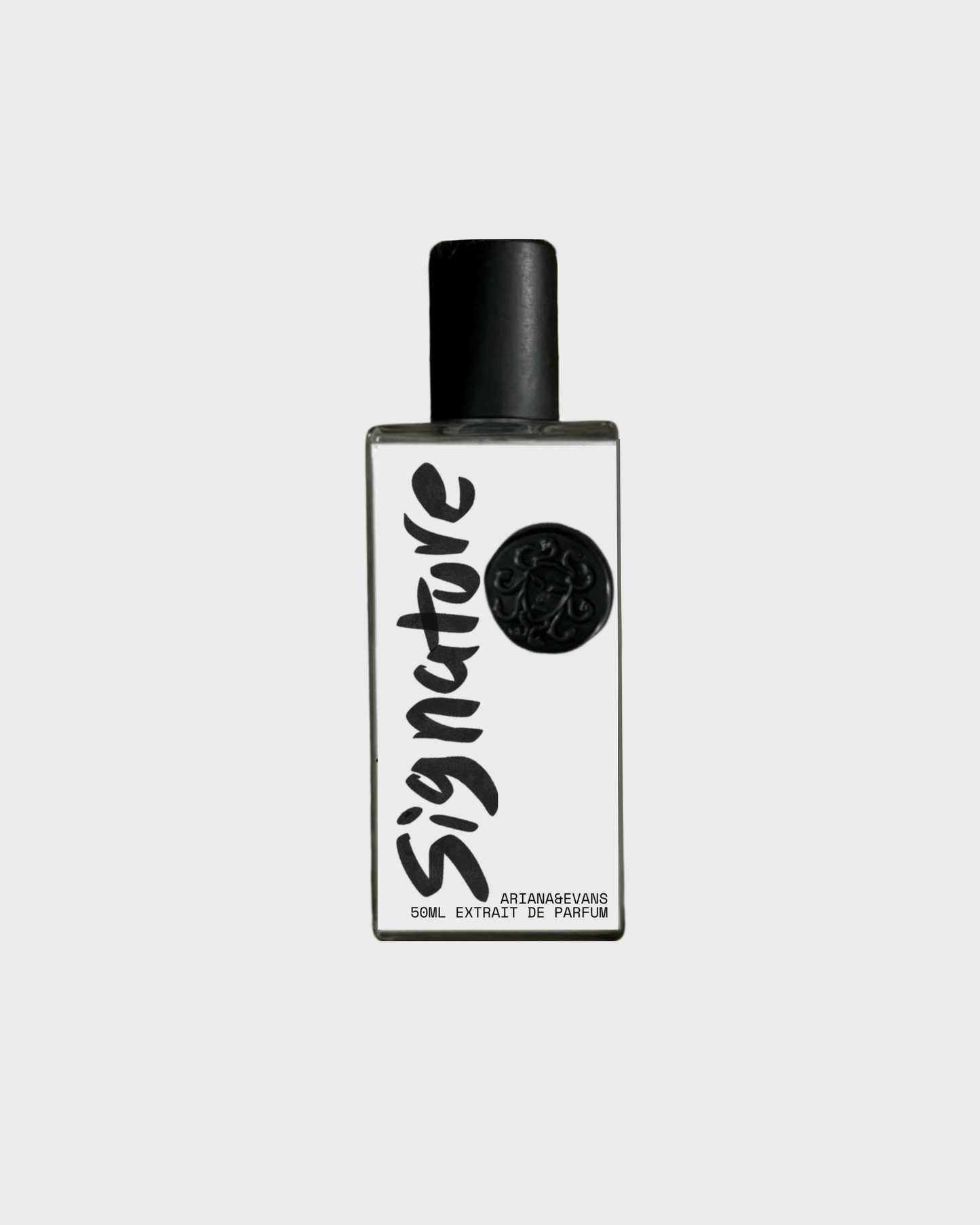 Signature extrait de parfum bottle showcasing niche fragrance with tobacco, whiskey & sandalwood notes.