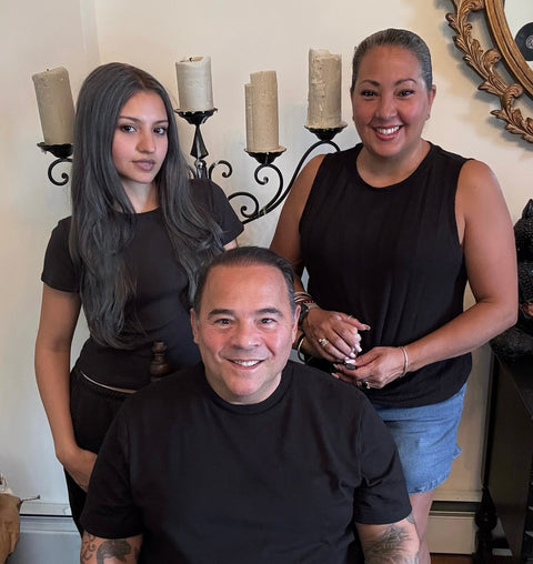 Ariana & Evans owners posing in showroom