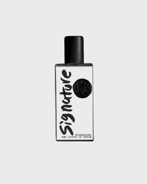 Signature extrait de parfum bottle showcasing niche fragrance with tobacco, whiskey & sandalwood notes.
