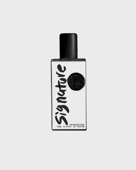 Signature extrait de parfum bottle showcasing niche fragrance with tobacco, whiskey & sandalwood notes.