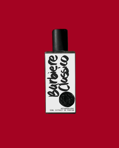 Barbiere Classico extrait de parfum bottle on a red background, representing the best barbershop fragrance.